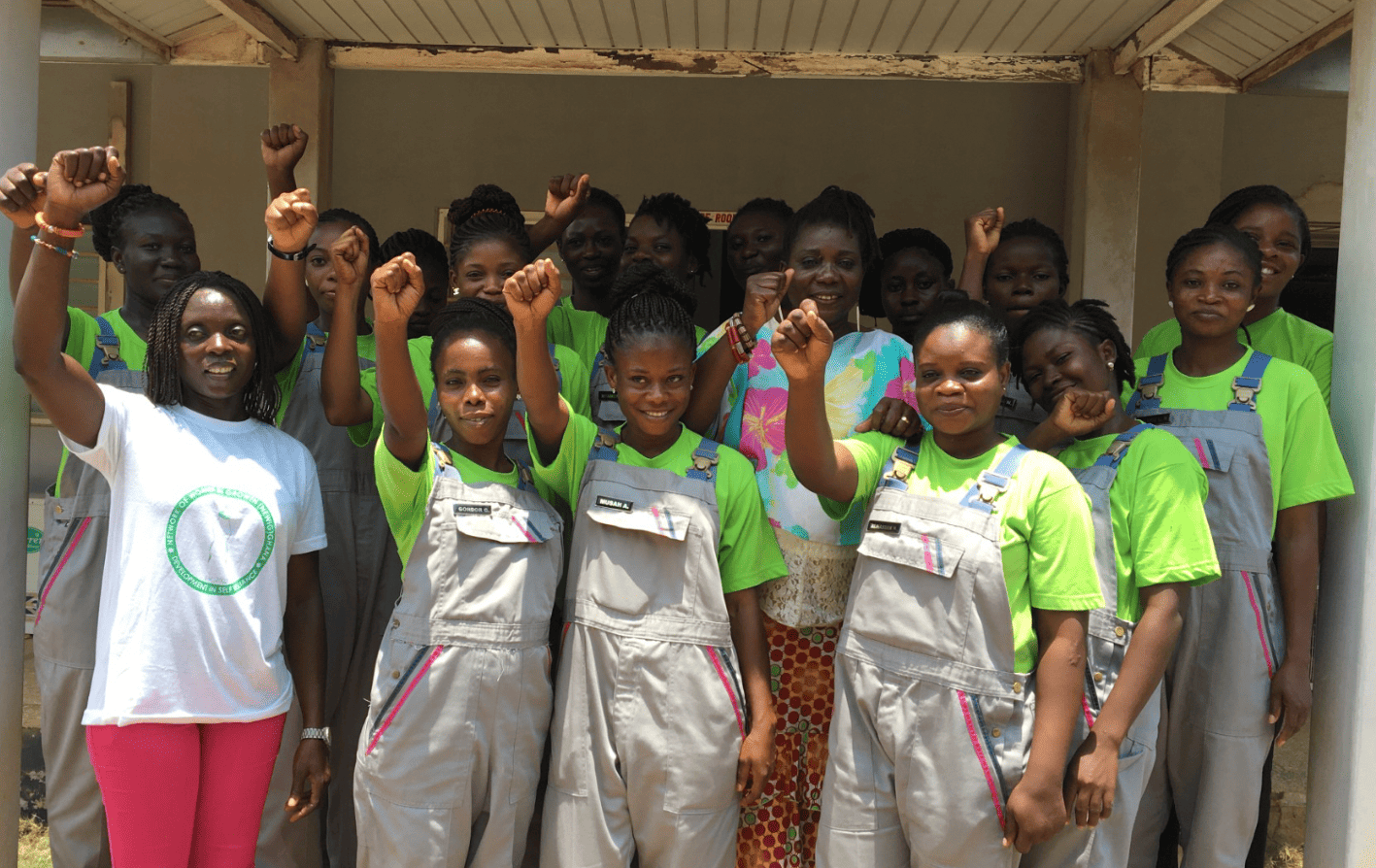 A group of people holding up their fists